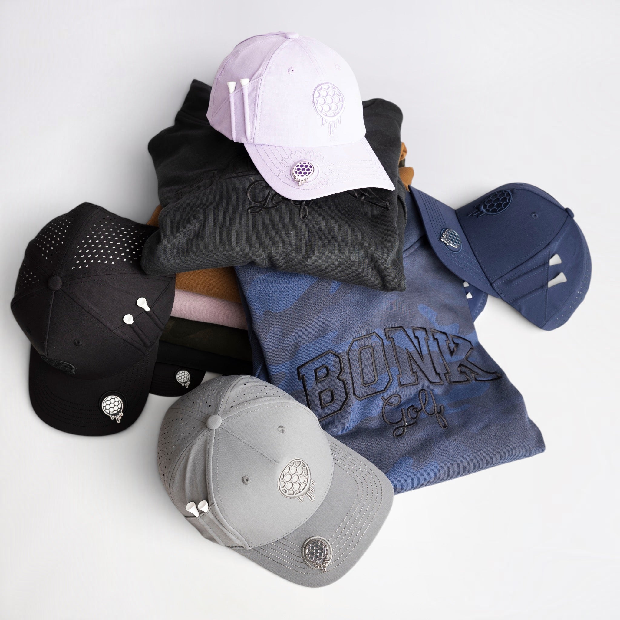 Purple and black cap with a colorful sunflower logo on the front.